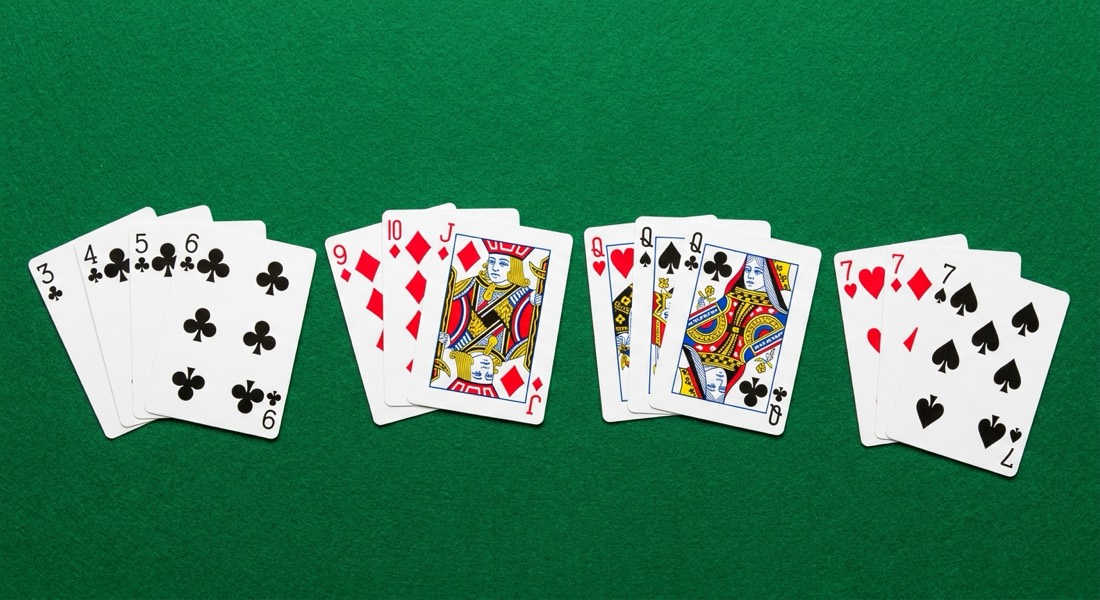 A winning 13-card Indian rummy hand arranged into a pure sequence, a run, and two sets on a green felt table